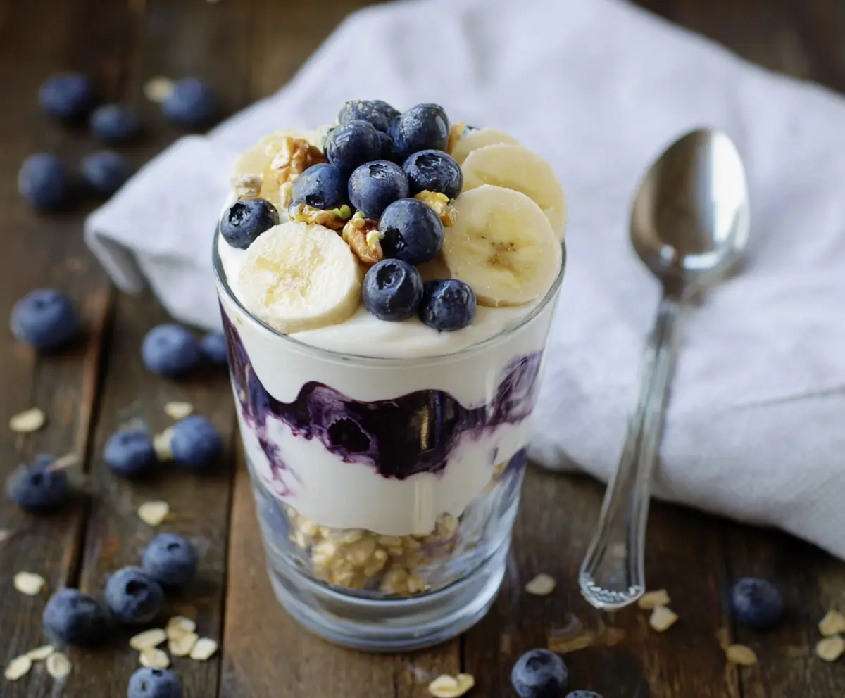 Delicious Blueberry Banana Yogurt Parfait layered with fresh fruits and creamy yogurt.