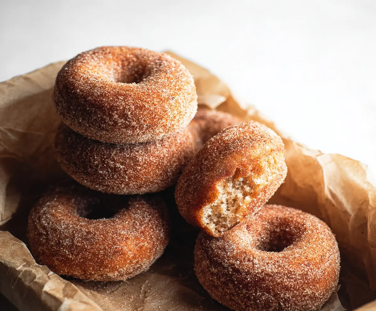 Delicious sourdough discard apple cider donuts bread on a rustic wooden table.