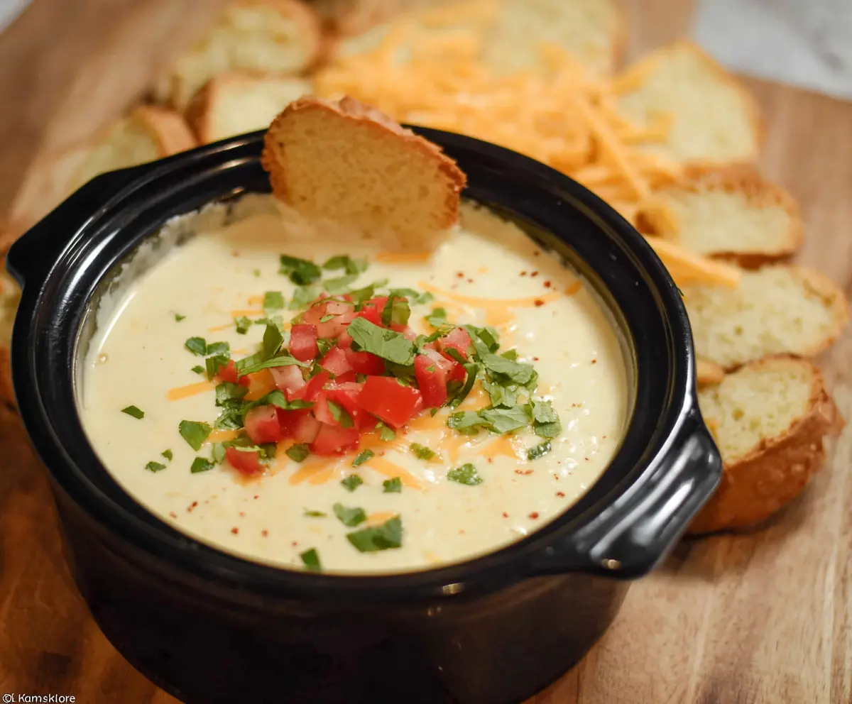 Creamy Crock Pot White Cheese Dip served with fresh tortilla chips for a savory appetizer.