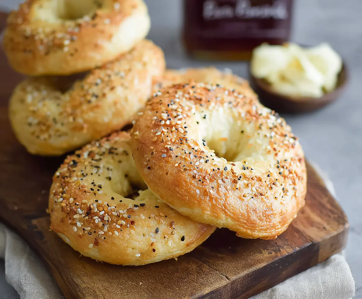 Delicious gluten-free cottage cheese bagels on a wooden cutting board, perfect for breakfast or brunch.
