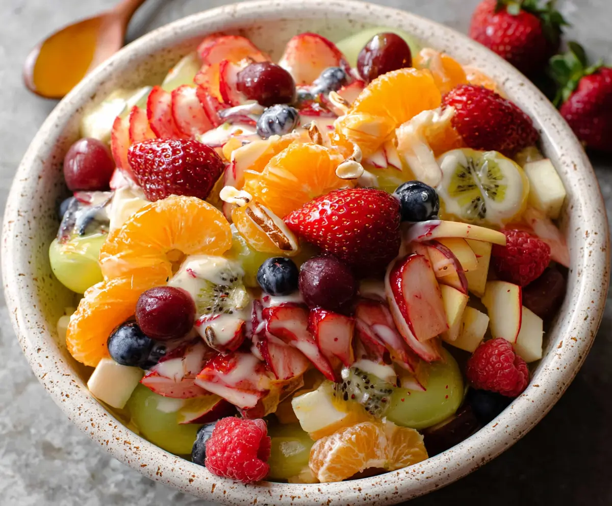 Colorful Easter Fruit Salad with fresh strawberries, grapes, kiwi, and oranges in a festive bowl