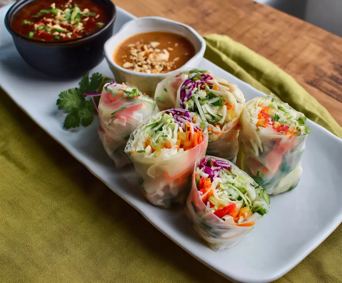 Fresh Thai vegetable spring rolls with colorful vegetables and rice paper, perfect for healthy snacking.